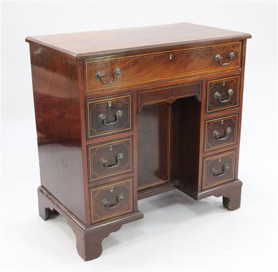 A George III mahogany and line inlaid kneehole desk, W.2ft 9in.